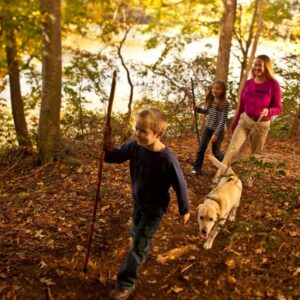 people smiling on nature hike