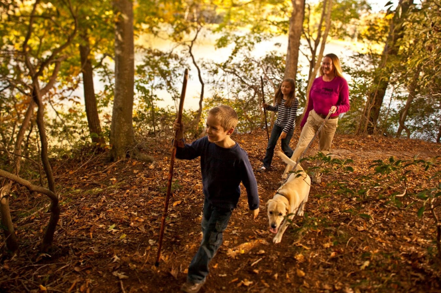 people smiling on nature hike