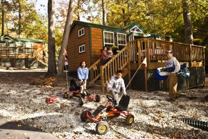 kids playing in front of cabin