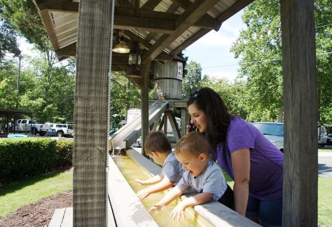 woman and children playing